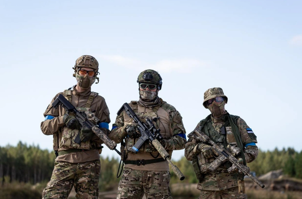 Airsoft players in tactical gear at Estonian outdoor airsoft field